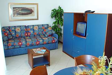 Rezidence Oltremare - Jídelna s kuchyňským koutem a rozkládacím gaučem pro 2 osoby